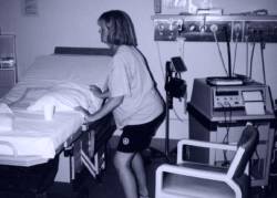 Woman approaching obstetric bed